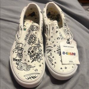 Vans White Slip-On Shoes with Black Graphic Design